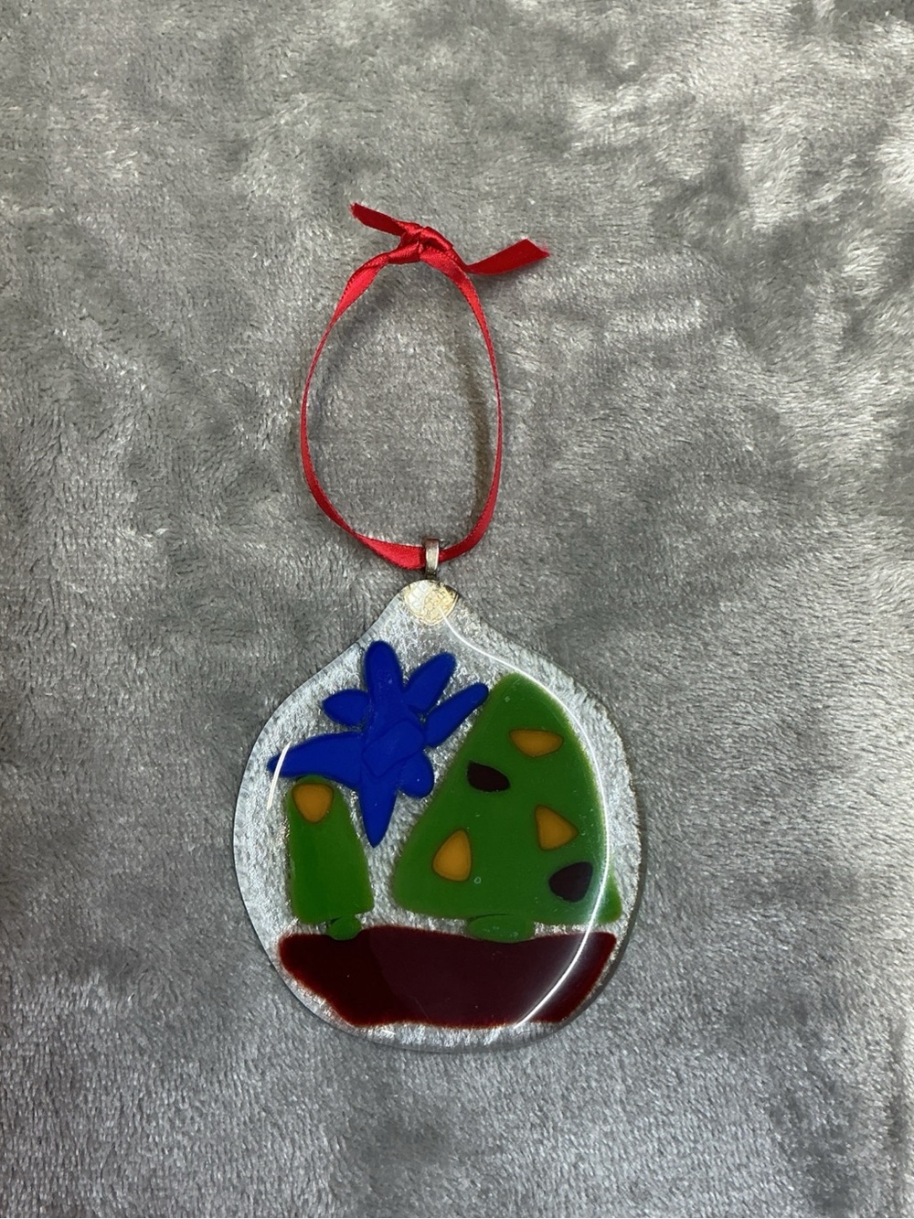 Handmade Fused Glass Christmas Ornament Round Shape lays flat hanging